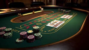 Tim operasional v77slot di studio live dealer dengan meja blackjack dan roulette